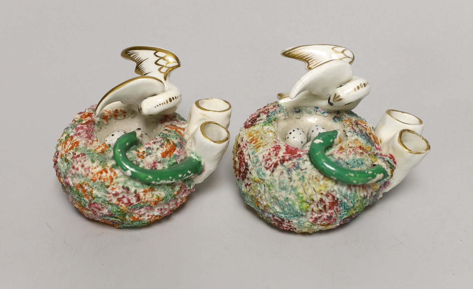 Two similar Staffordshire porcelain 'bird's nest' quill holders, c.1830-50